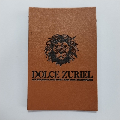 Le label fait sur commande a gravé les corrections en refief en cuir pour des jeans de sacs à main d'habillement