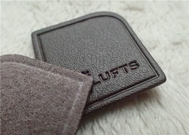 Nègre - le cuir de relief veiné par Brown raccorde le logo à haute fréquence de marque cousant sur le vêtement