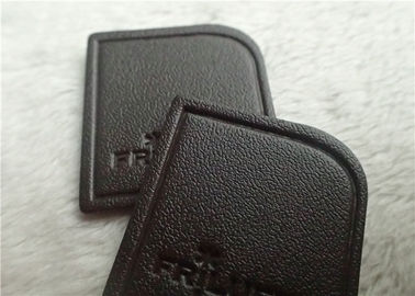 Nègre - le cuir de relief veiné par Brown raccorde le logo à haute fréquence de marque cousant sur le vêtement