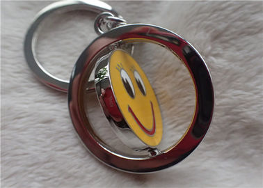 Colorez les cadeaux promotionnels personnalisés argentés de chaîne principale avec le visage jaune de sourire rotatif
