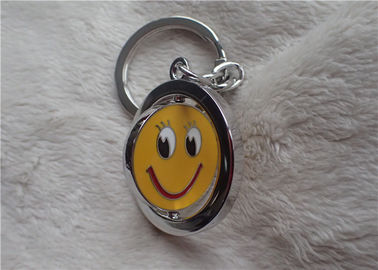 Colorez les cadeaux promotionnels personnalisés argentés de chaîne principale avec le visage jaune de sourire rotatif