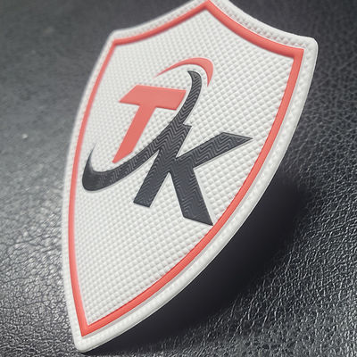 Transfert thermique en caoutchouc doux de relief imprimé fait sur commande de la correction 3D Tpu pour le logo de tissu
