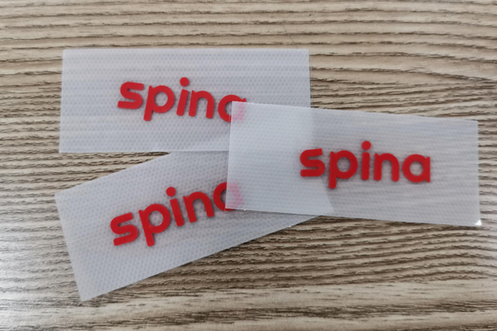 Matériel en caoutchouc adapté aux besoins du client par vêtement de plastique silicone de label du transfert 3D