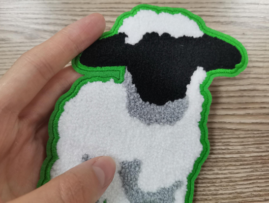Le transfert de chaleur marque le matériel de coton de correction de broderie de serviette adapté aux besoins du client
